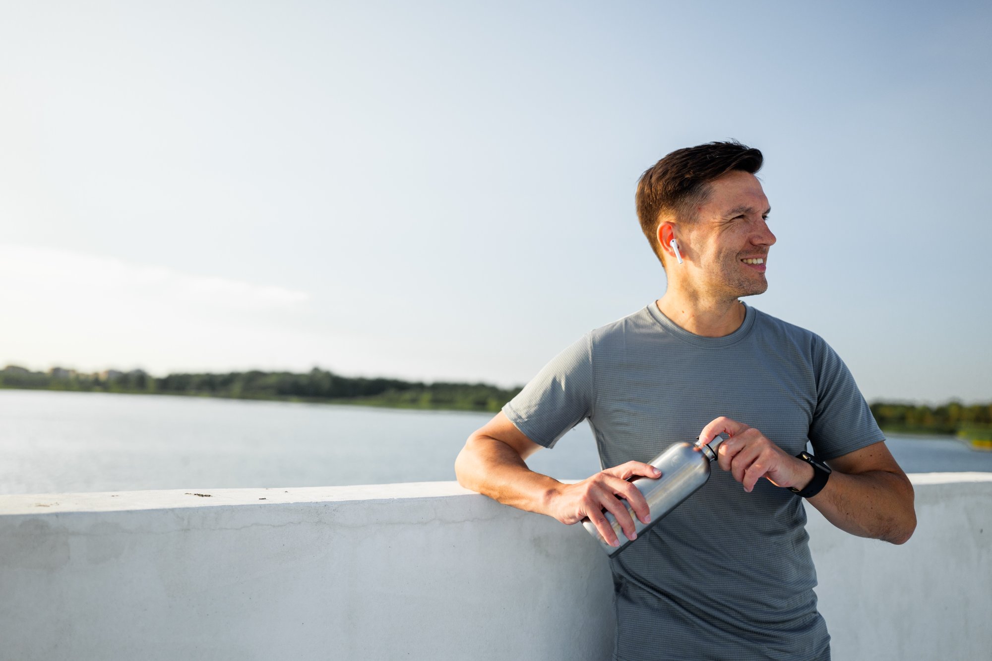 Active middle-aged man taking a break outdoors, representing men's hormone health care in Katonah, NY