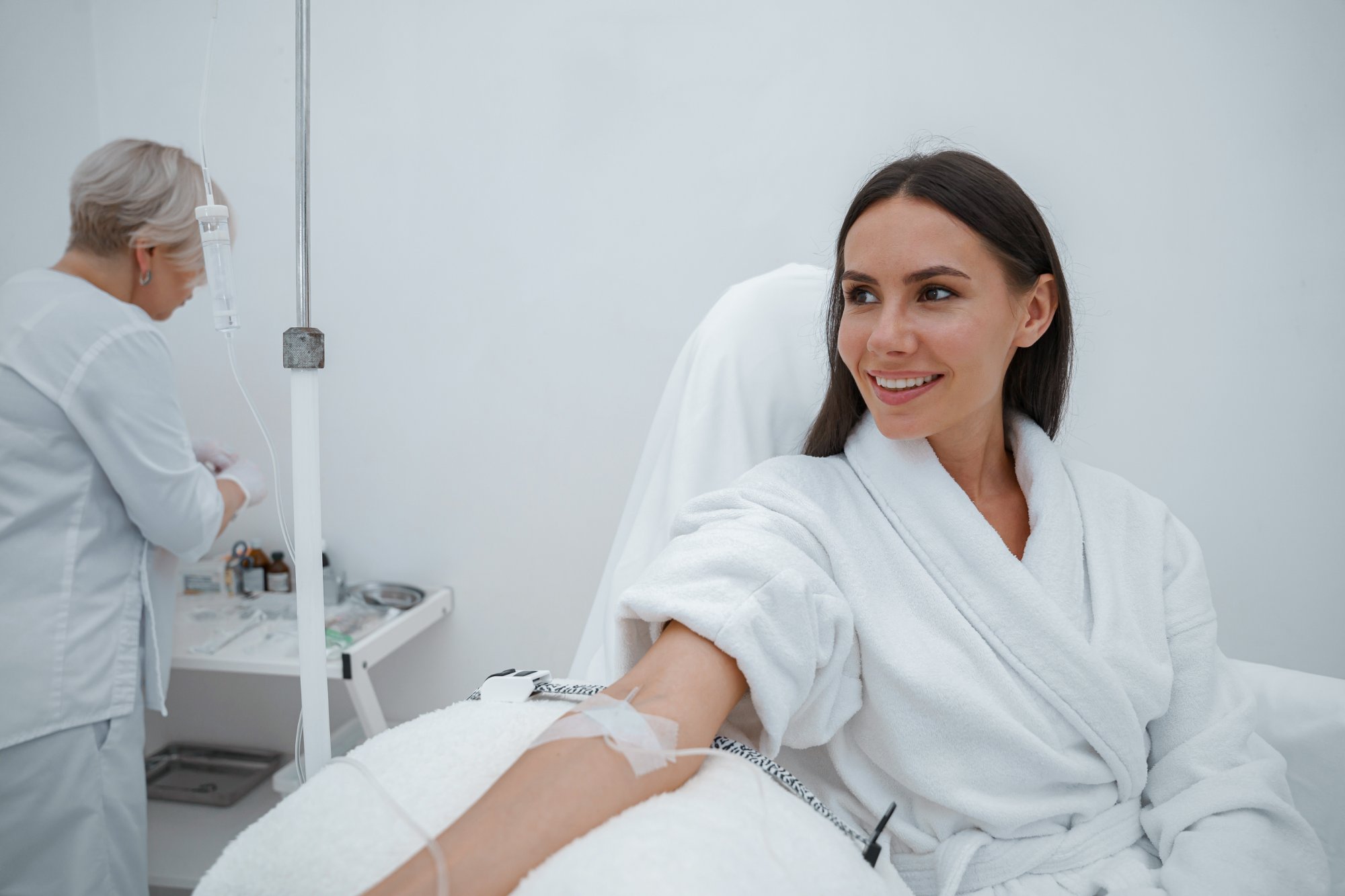 Patient relaxing in a robe during an IV therapy session as part of the metabolic reset program at Form & Function in Katonah, NY